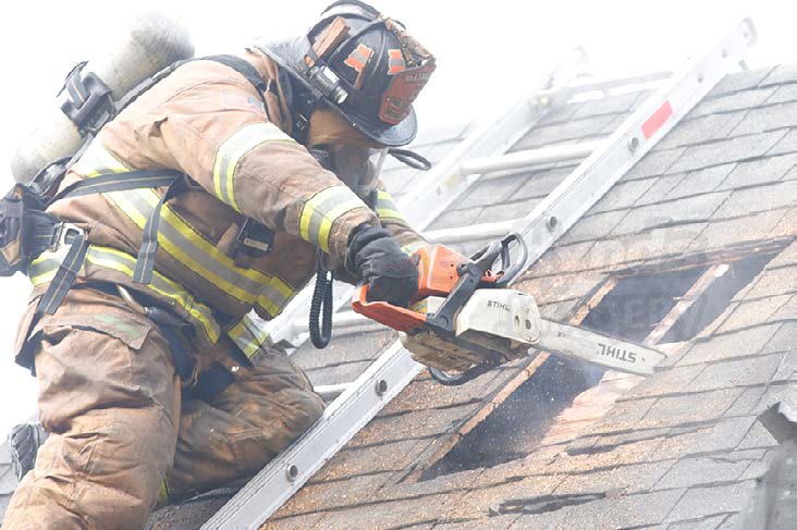 Firefighter working on a roof